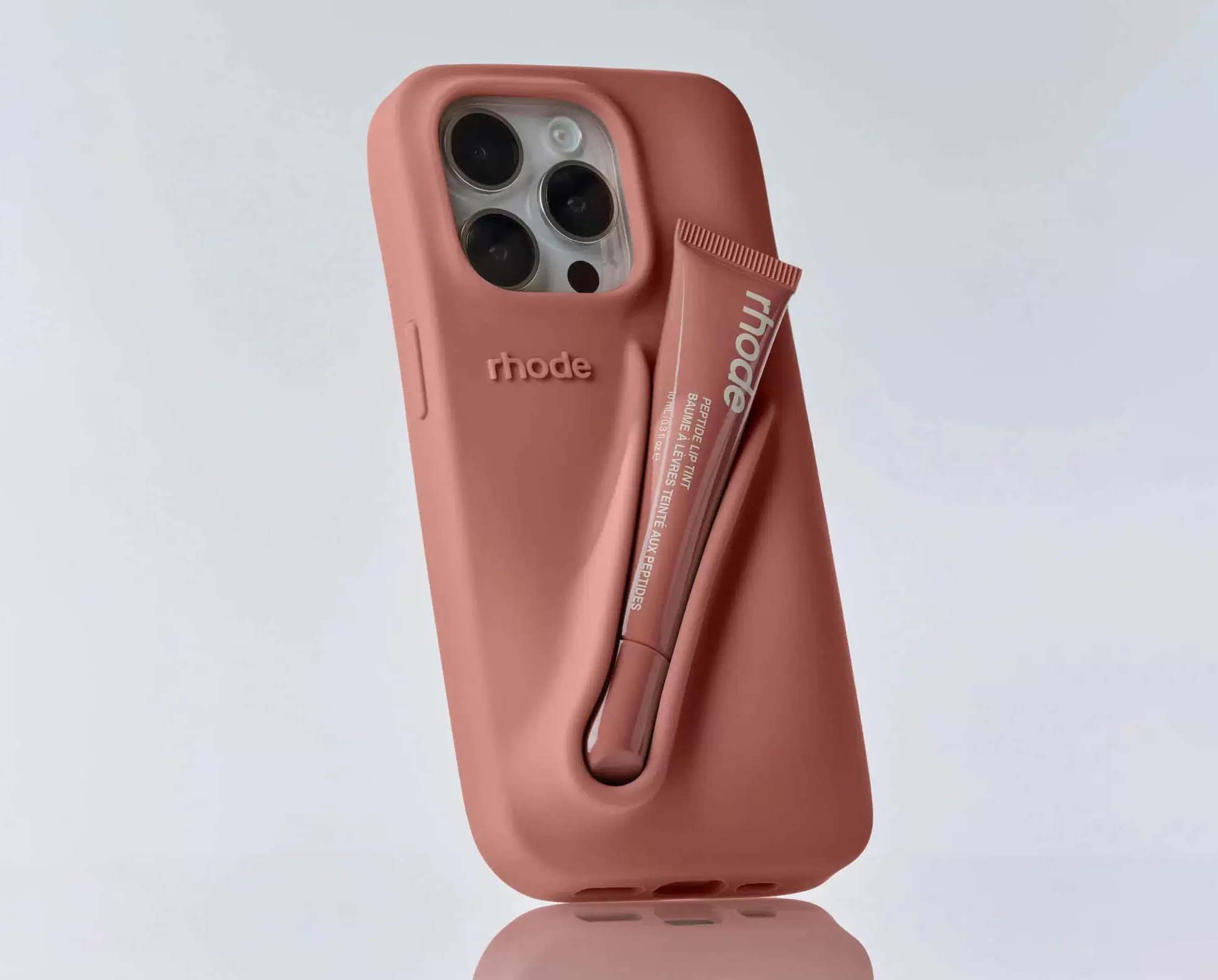 lip gloss phone case in terracotta pink with gloss inserted